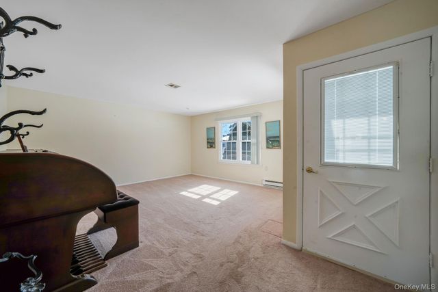 430 Falmouth Court A, Ridge, NY 11961