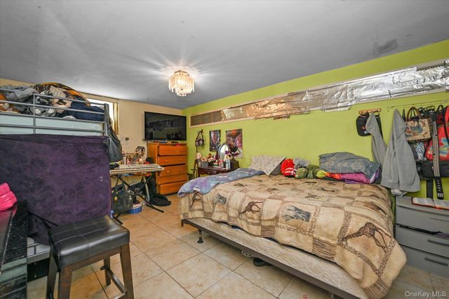 77-06 Kneeland Avenue, Elmhurst, NY 11373