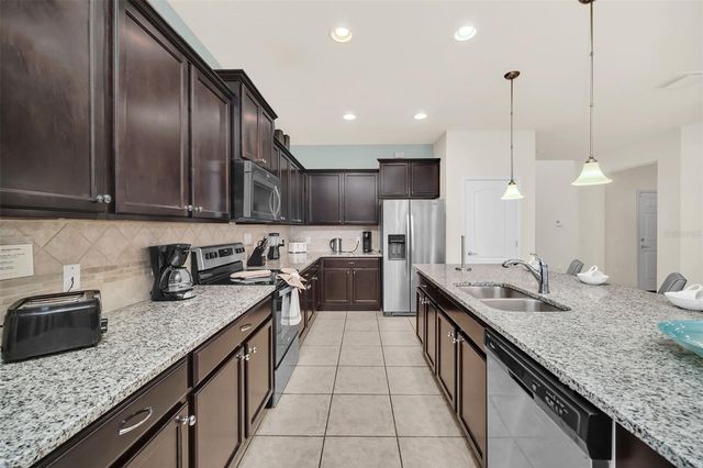 8887 MENTON LOOP, Kissimmee, FL 34747
