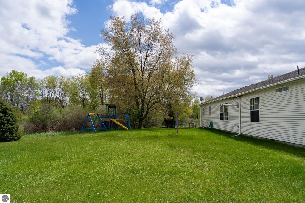 Image 11 of property listing at 464 N Rolland Road, Weidman, MI 48893