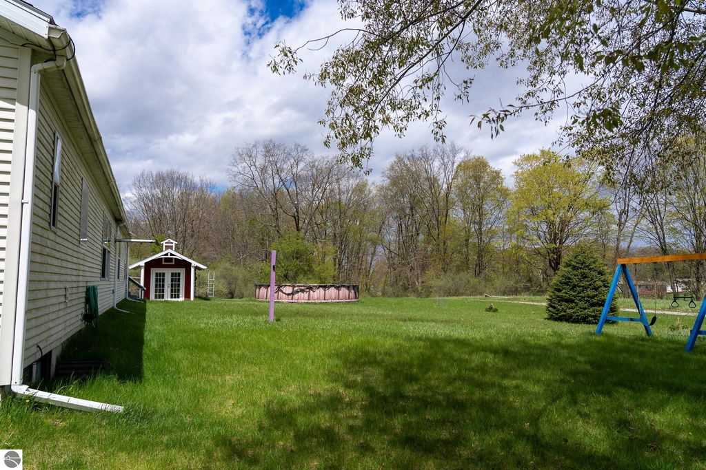 Image 12 of property listing at 464 N Rolland Road, Weidman, MI 48893