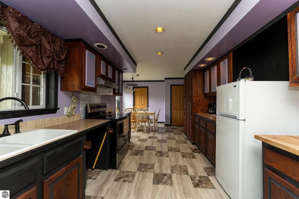 Image 26 of property listing at 464 N Rolland Road, Weidman, MI 48893