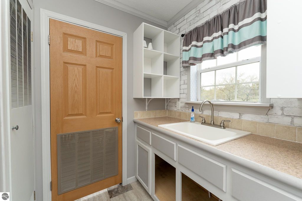 Image 55 of property listing at 464 N Rolland Road, Weidman, MI 48893