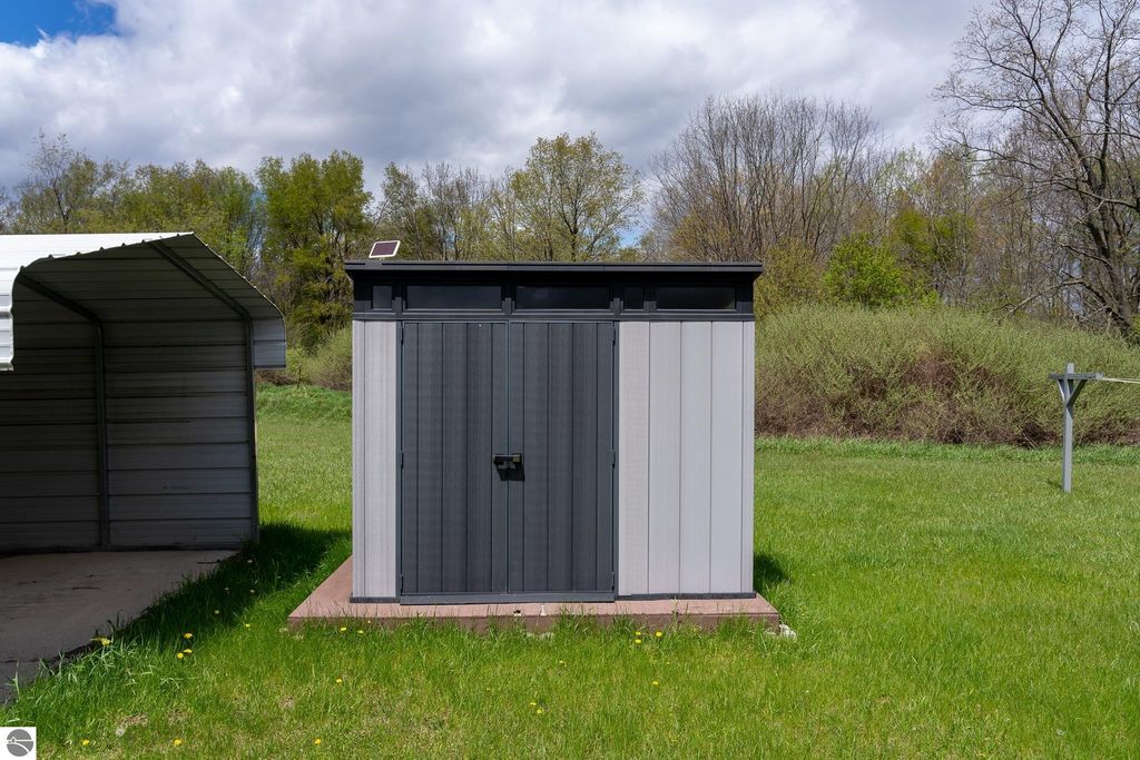 Image 60 of property listing at 464 N Rolland Road, Weidman, MI 48893