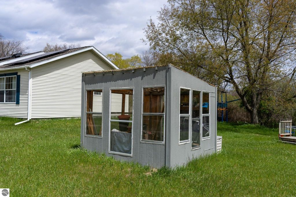 Image 65 of property listing at 464 N Rolland Road, Weidman, MI 48893