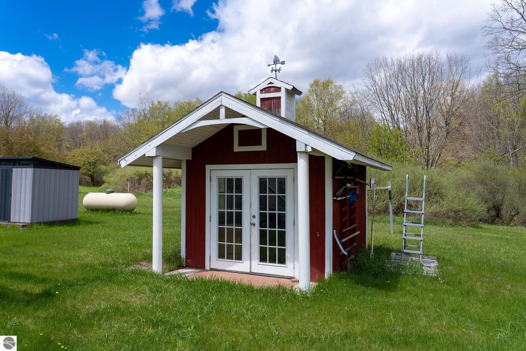 Image 66 of property listing at 464 N Rolland Road, Weidman, MI 48893