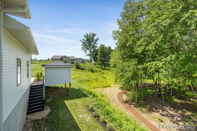 9465 Wabasis Pointe Drive Ne, Oakfield Twp, MI 48838