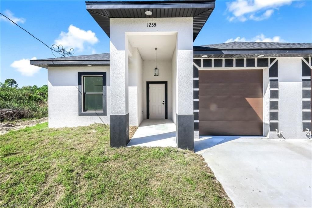 1235/1237 Hillcrest ST E, LEHIGH ACRES, FL 33974 — photo 2
