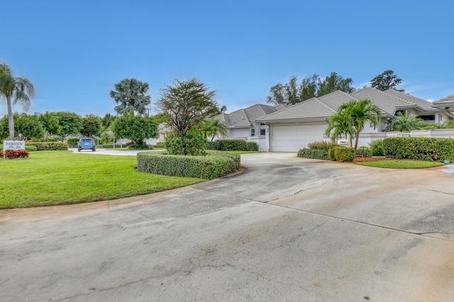 201 Orange Tree Drive, Atlantis, FL 33462