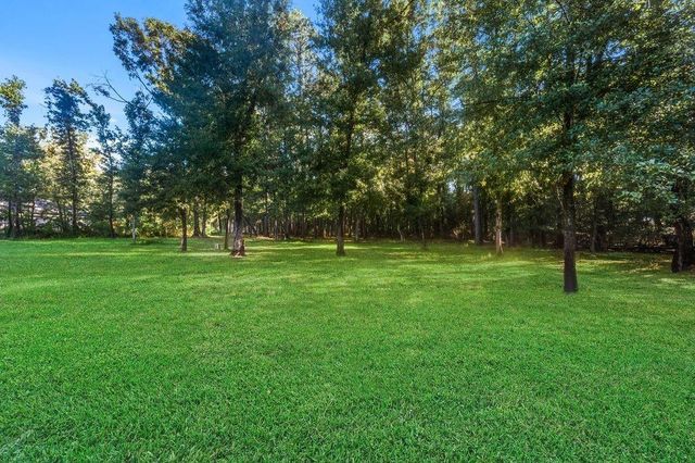 703 Lago Trace Drive, Huffman, TX 77336