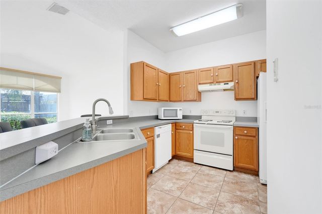 1033 WOODFLOWER WAY, Clermont, FL 34714