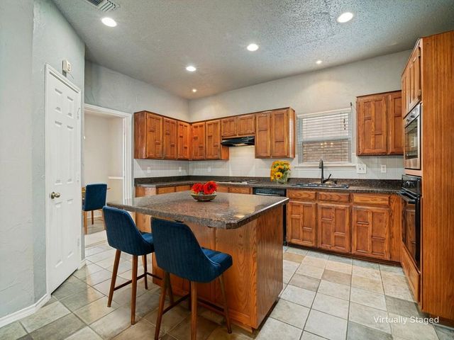 9102 Barton Creek Drive, Rowlett, TX 75089