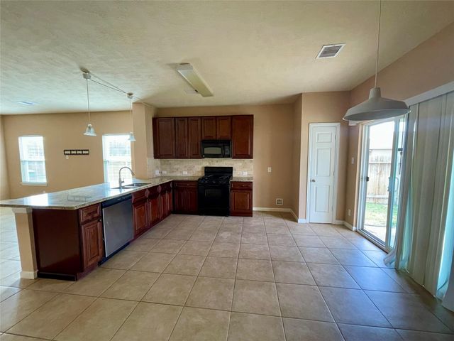 10803 Woodwind Shadows Drive, Cypress, TX 77433