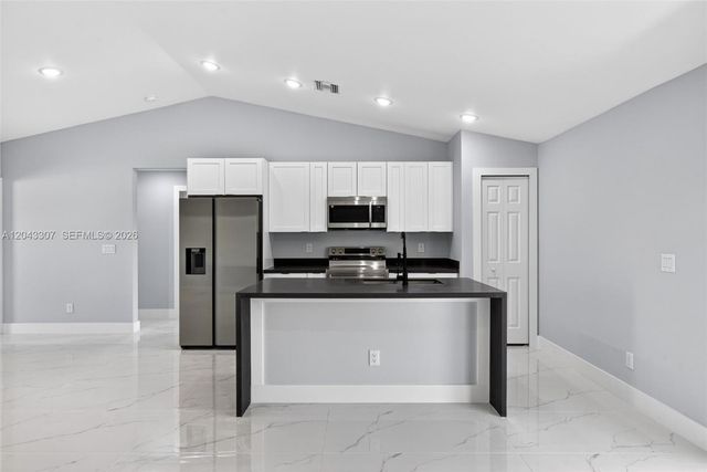 702 Carbon Street, Lehigh Acres, FL 33974