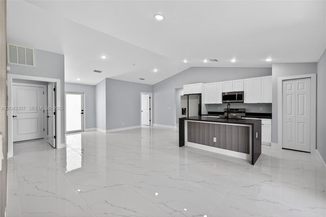 702 Carbon Street, Lehigh Acres, FL 33974