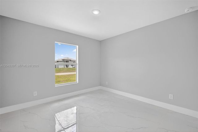 702 Carbon Street, Lehigh Acres, FL 33974