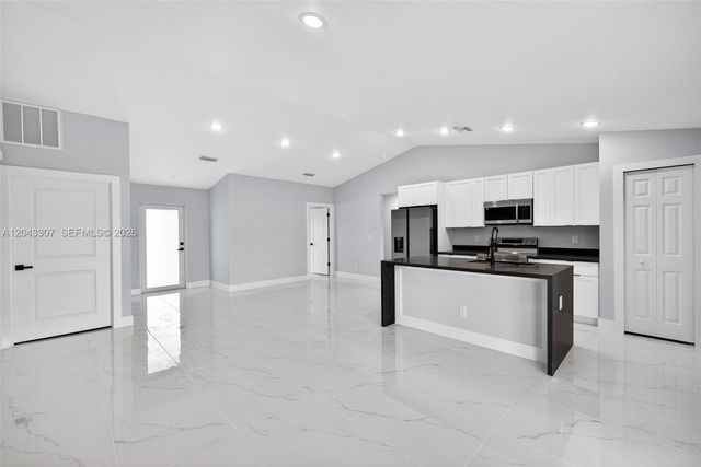 702 Carbon Street, Lehigh Acres, FL 33974