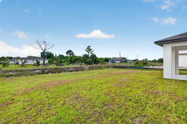 702 Carbon Street, Lehigh Acres, FL 33974