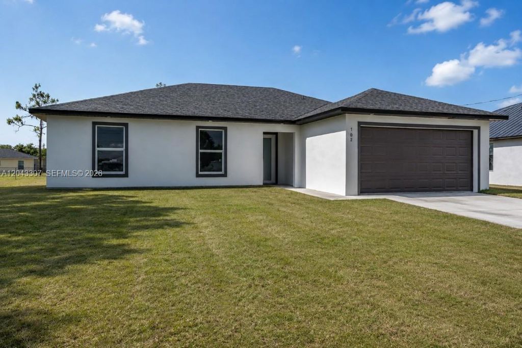 702 Carbon Street, Lehigh Acres, FL 33974