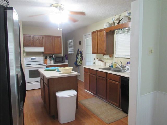 242 Sir Lancelot Drive N, Sargent, TX 77414