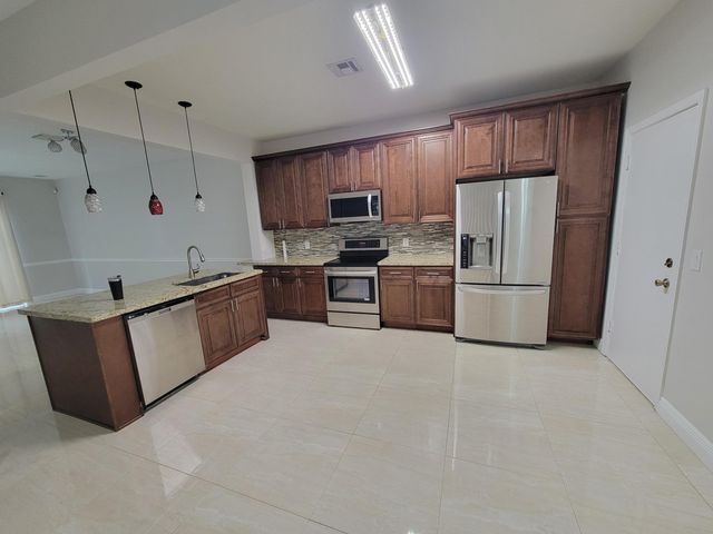1042 Woodfield Road, Greenacres, FL 33415