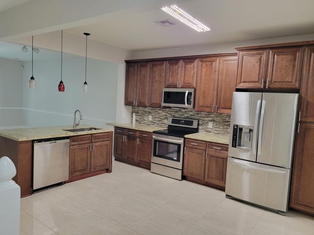 1042 Woodfield Road, Greenacres, FL 33415