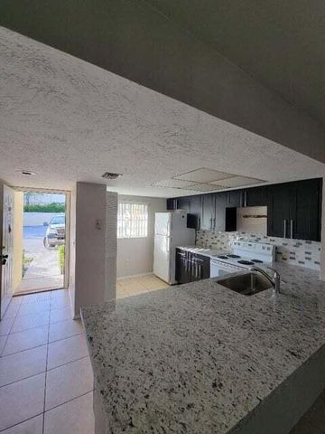 104 Palm Beach Trace Drive, Royal Palm Beach, FL 33411