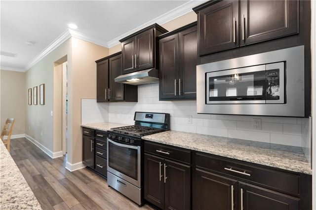 7700 Winding Cypress DR, Naples, FL 34114