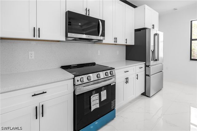 1113 Enrique ST E, Lehigh Acres, FL 33974