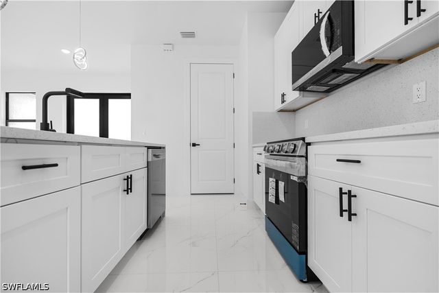 1113 Enrique ST E, Lehigh Acres, FL 33974