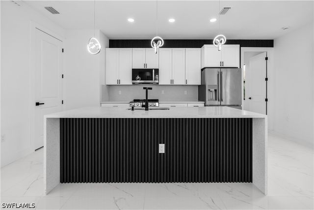 1113 Enrique ST E, Lehigh Acres, FL 33974