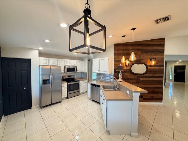 4426 WINDSONG AVENUE, North Port, FL 34287