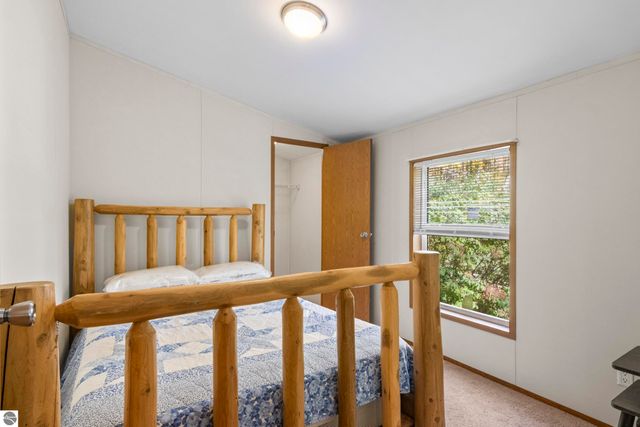 8761 Partridge Lane, Mancelona, MI 49659