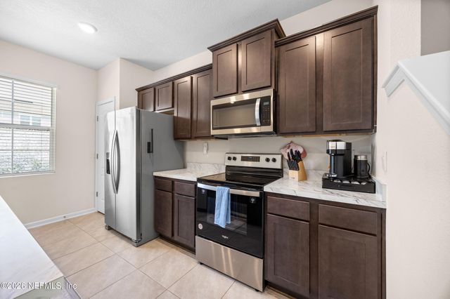585 RUNNING WOODS Street, Orange Park, FL 32065