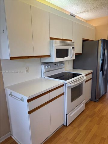 12950 SW 13th St 412D, Pembroke Pines, FL 33027