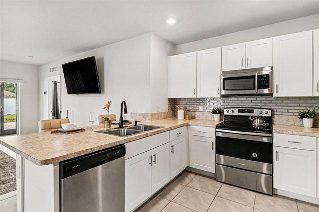 1956 EGRET MEADOWS AVENUE, Kissimmee, FL 34744
