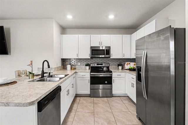 1956 EGRET MEADOWS AVENUE, Kissimmee, FL 34744