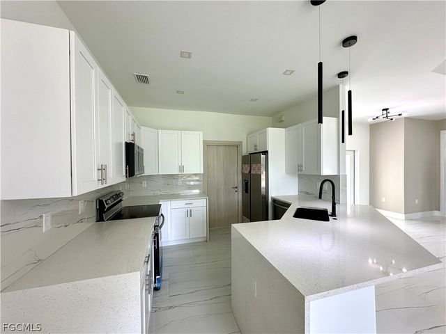 418 Wellington AVE, Lehigh Acres, FL 33972