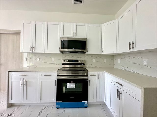 418 Wellington AVE, Lehigh Acres, FL 33972