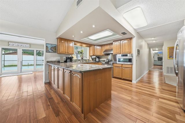 7712 LAKESIDE WOODLANDS, Hudson, FL 34667