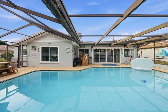 7712 LAKESIDE WOODLANDS, Hudson, FL 34667