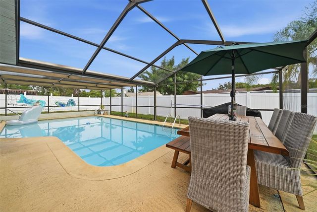 7712 LAKESIDE WOODLANDS, Hudson, FL 34667