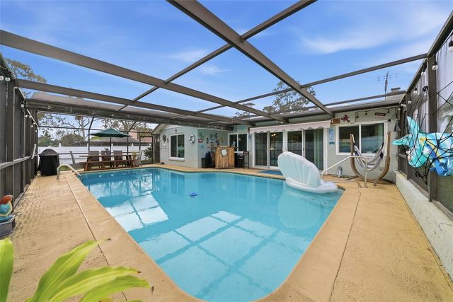 7712 LAKESIDE WOODLANDS, Hudson, FL 34667