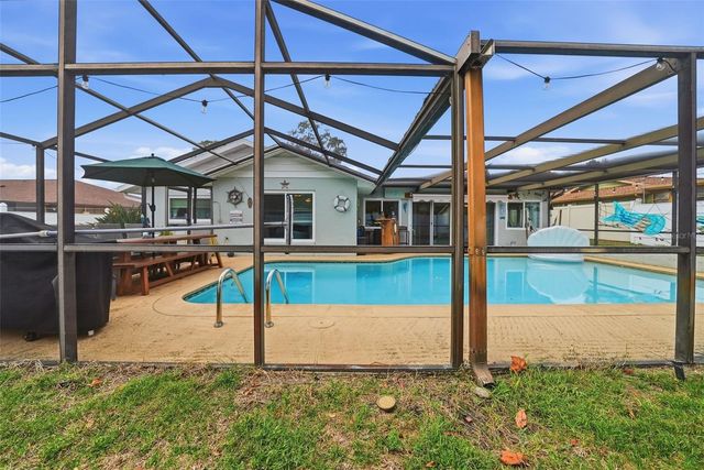 7712 LAKESIDE WOODLANDS, Hudson, FL 34667