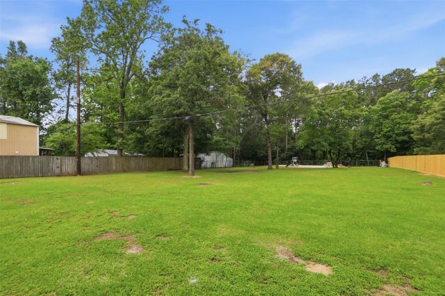 12739 Woodcreek Drive, Willis, TX 77318