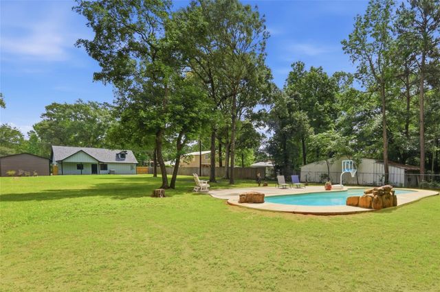 12739 Woodcreek Drive, Willis, TX 77318