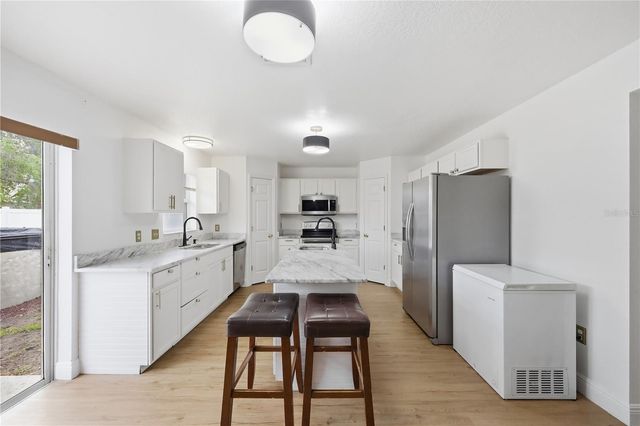 627 WOODLAND CREEK BOULEVARD, Kissimmee, FL 34744