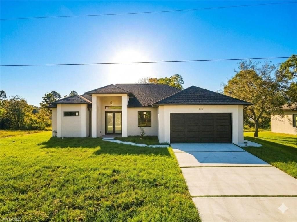 1102 Greenwood AVE, LEHIGH ACRES, FL 33972 — exterior