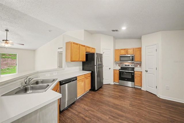 909 BRISTLE CONE COURT, Minneola, FL 34715
