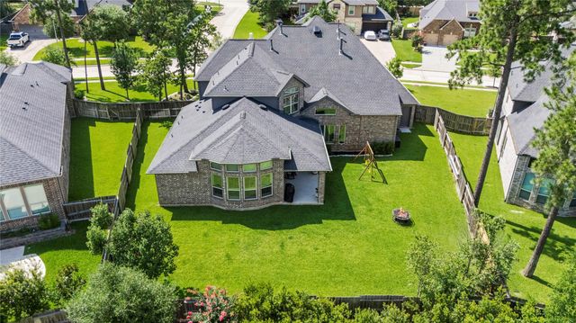 1002 Pleasant Pines Lane, Pinehurst, TX 77362